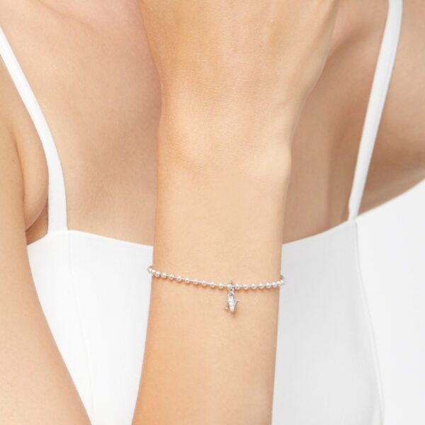 DMC0114_LETNS_DB0O2_110_Dodo_precious-letter-n-charm-white-diamonds-18k-white-gold.jpg